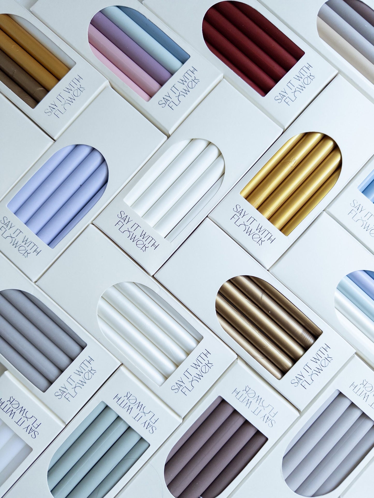 Set of assorted wax sticks in various colors, each infused with real pressed flowers - ideal for enhancing your letters, invitations, and crafting projects