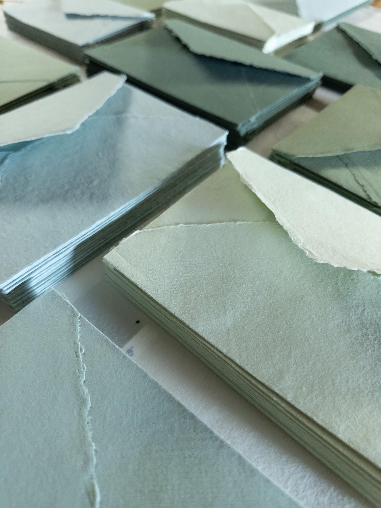green envelope featuring a natural deckle edge, crafted from artisanal cotton rag paper - perfect for adding a pop of color to your correspondence
