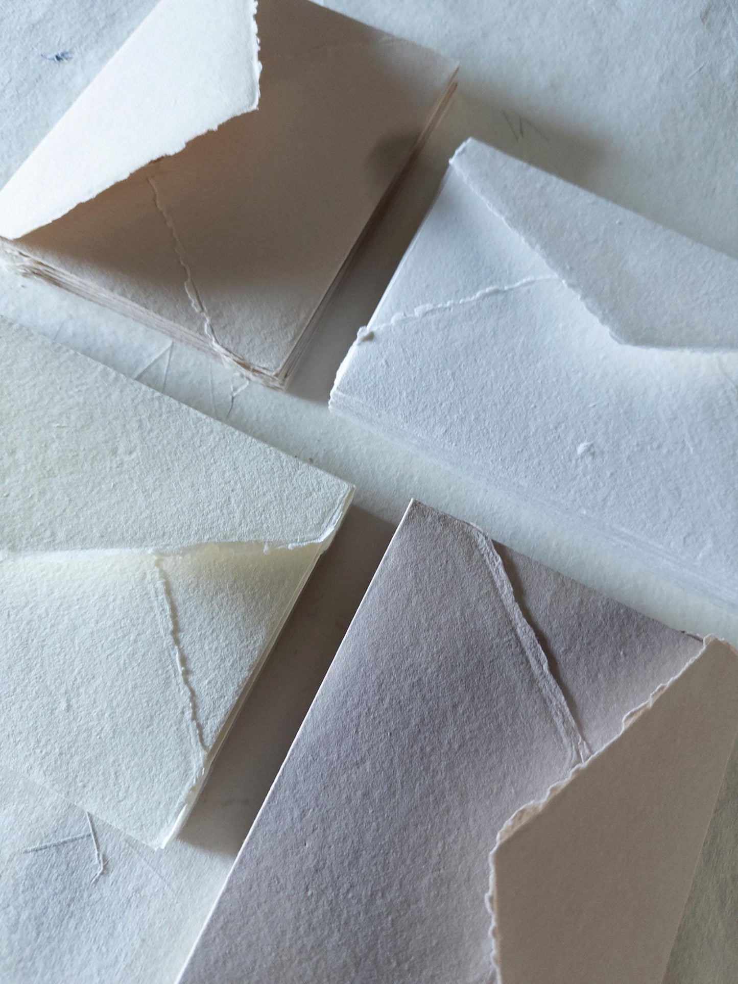 Earth-toned handmade envelope featuring a natural deckle edge, made from artisanal cotton rag paper - perfect for adding a touch of nature to your correspondence.