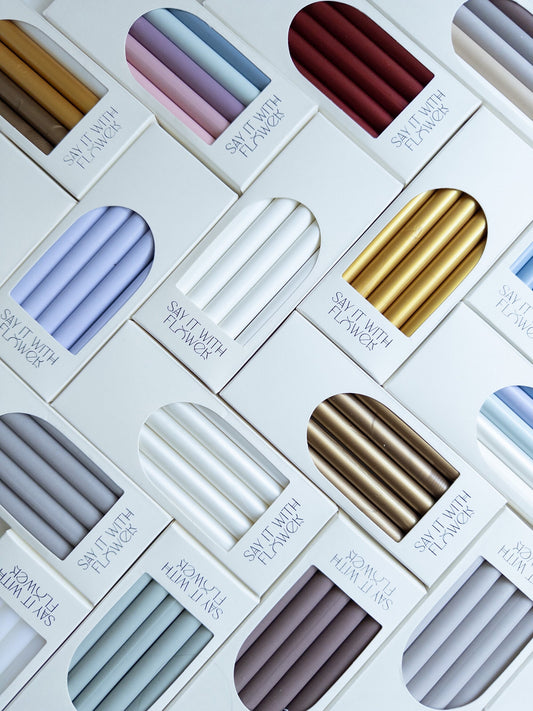 Set of assorted wax sticks in various colors, each infused with real pressed flowers - ideal for enhancing your letters, invitations, and crafting projects