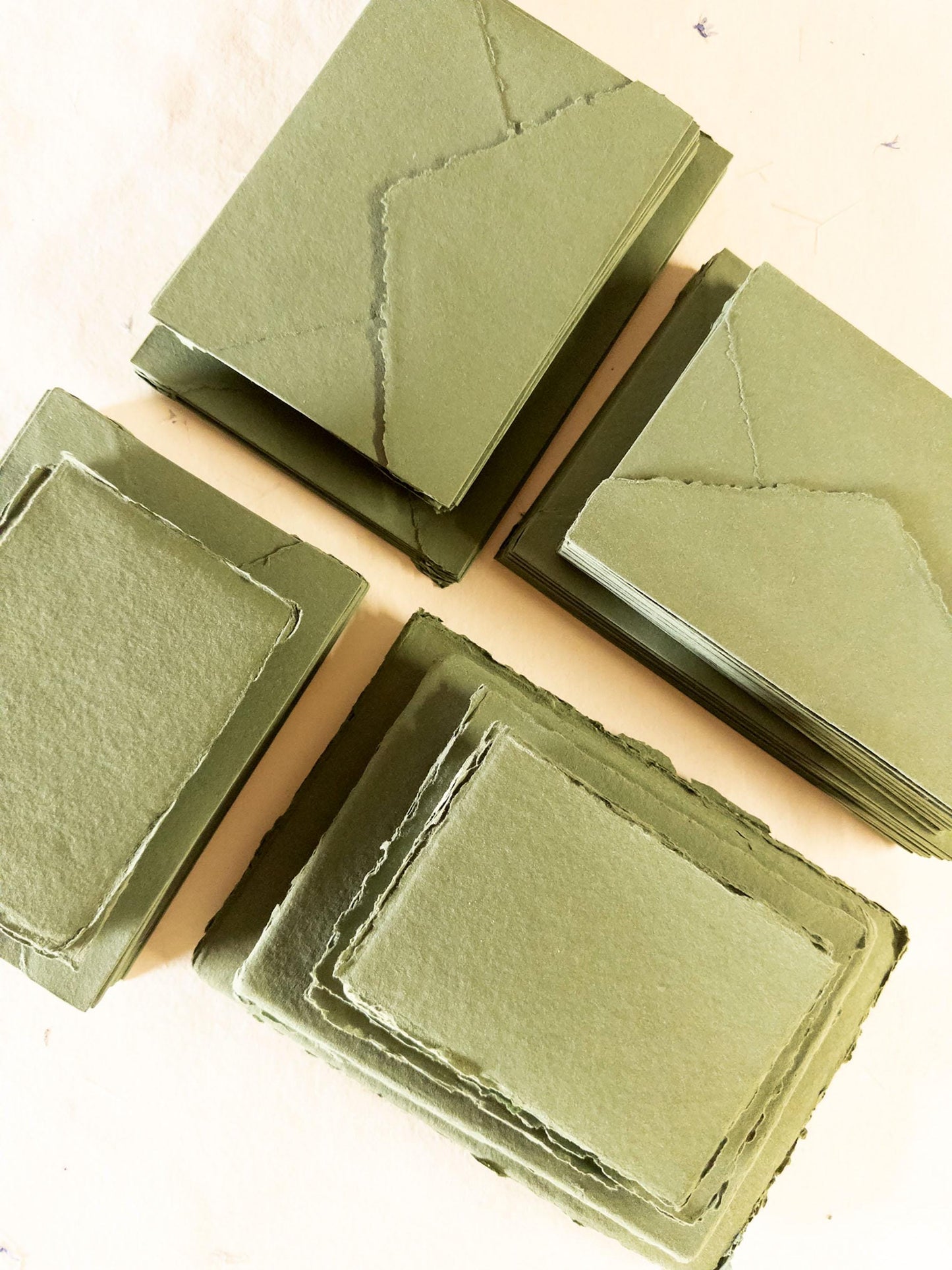 Close-up of Olive Green Deckle Edge Paper showing the textured edges and high-quality cotton rag materia